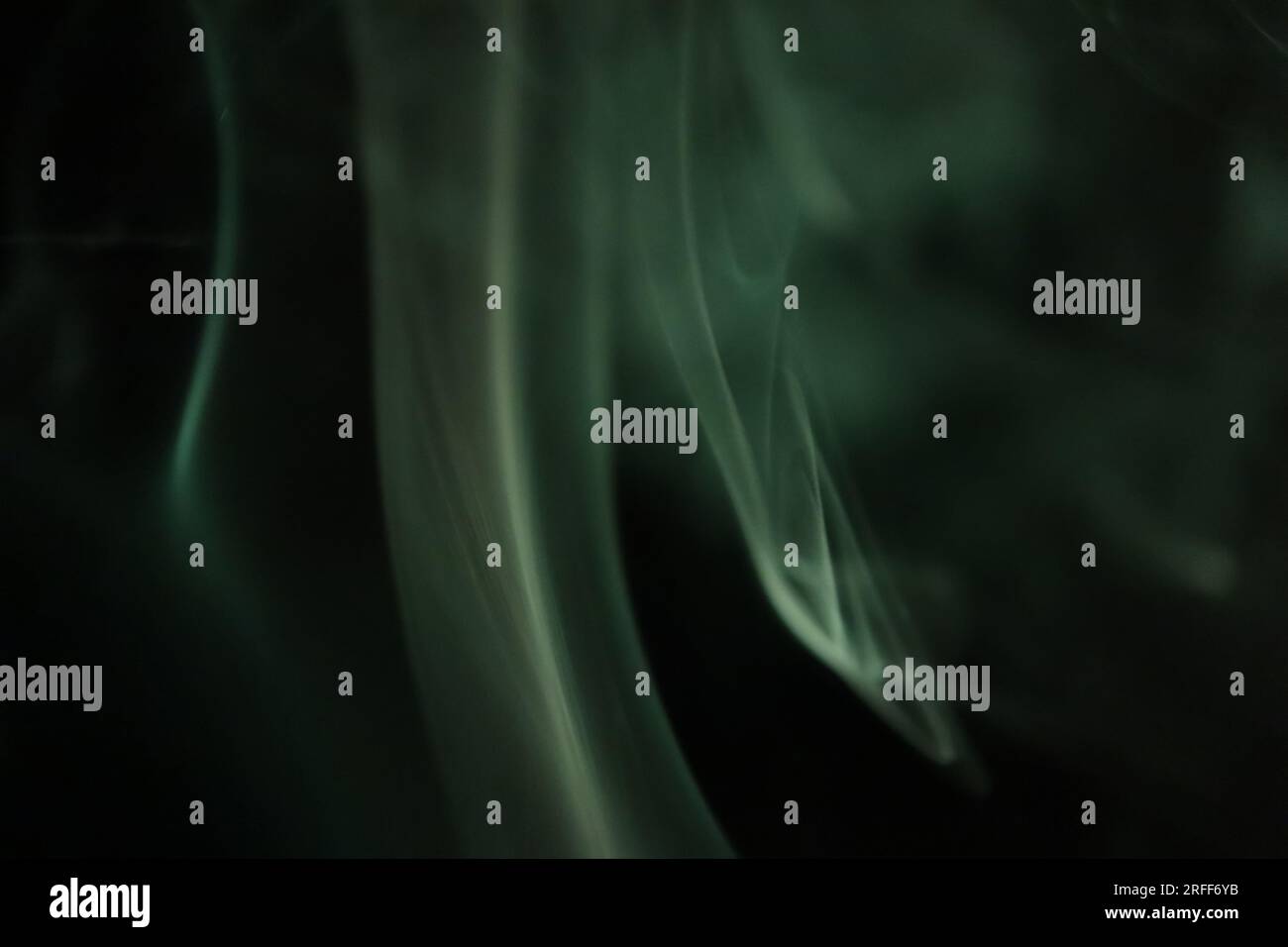 Green smoke on a dark background, patterns Stock Photo