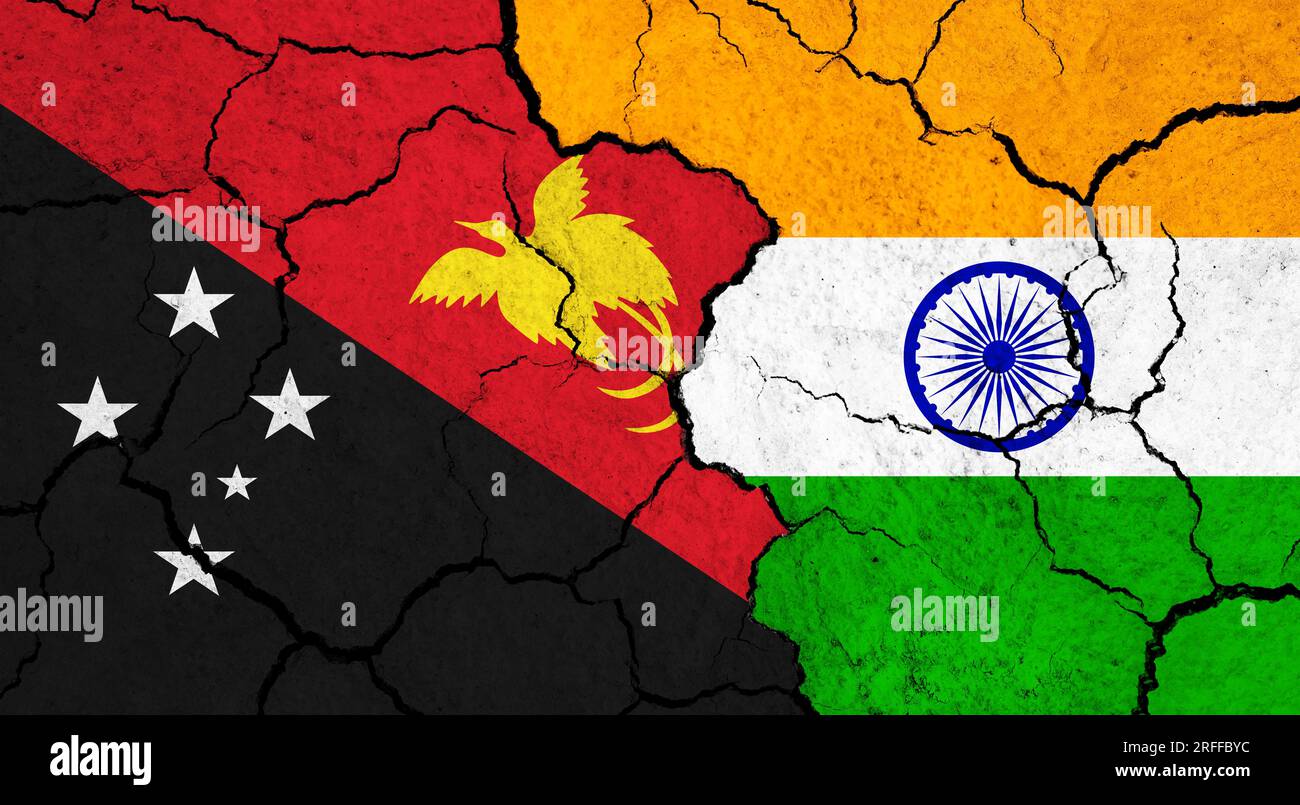 Flags of Papua New Guinea and India on cracked surface politics