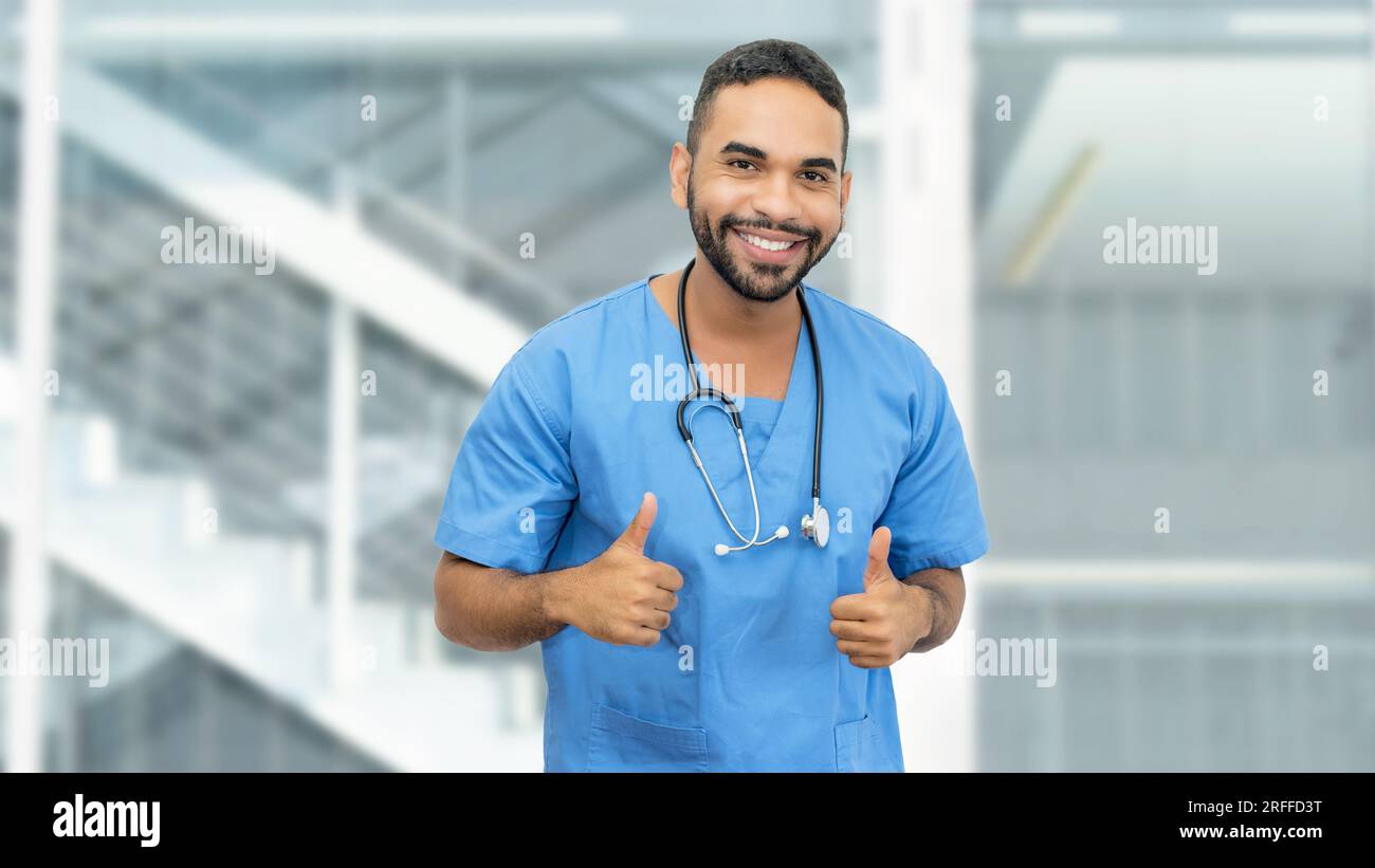 Friendly smiling doctor thumbs hi-res stock photography and images - Alamy