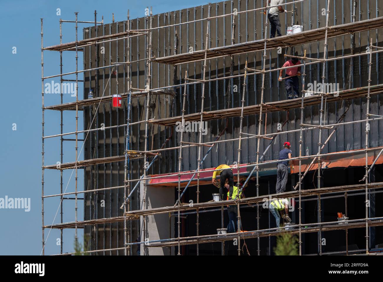 Workers on scaffolding at a construction site in Turkey Stock Photo