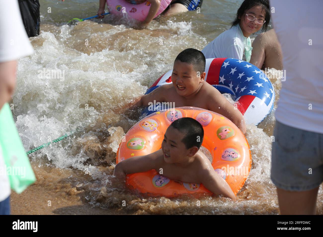 people-enjoy-summer-time-at-the-no-1-bathing-beach-in-qingdao-city