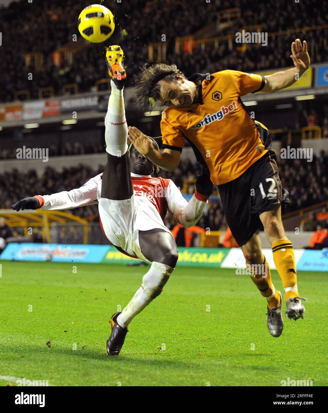 High kicking Bacary Sagna of Arsenal just misses the head of Stephen Hunt of Wolverhampton Wanderers  Barclays Premier League - Wolverhampton Wanderers v Arsenal 10/11/2010 Stock Photo