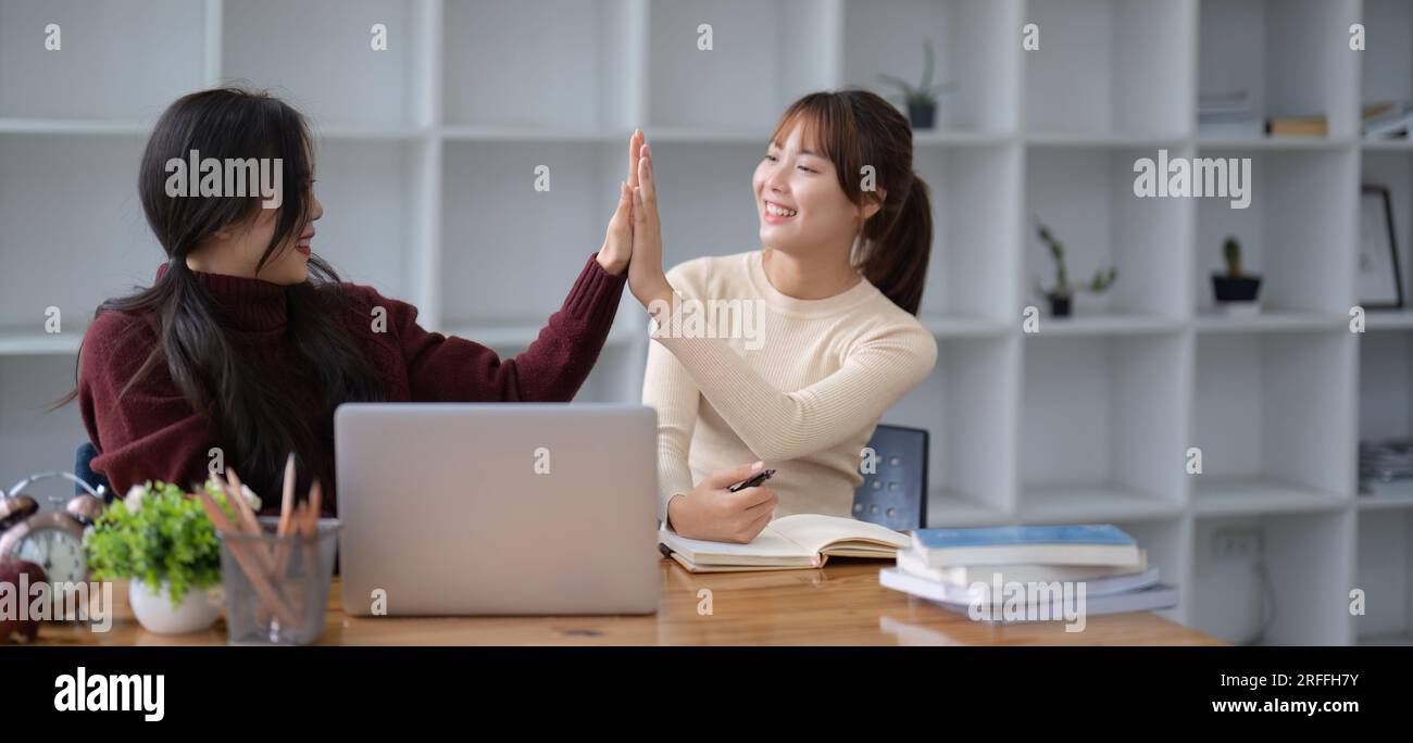 startup a business uses high five as a sign of success Stock Photo - Alamy