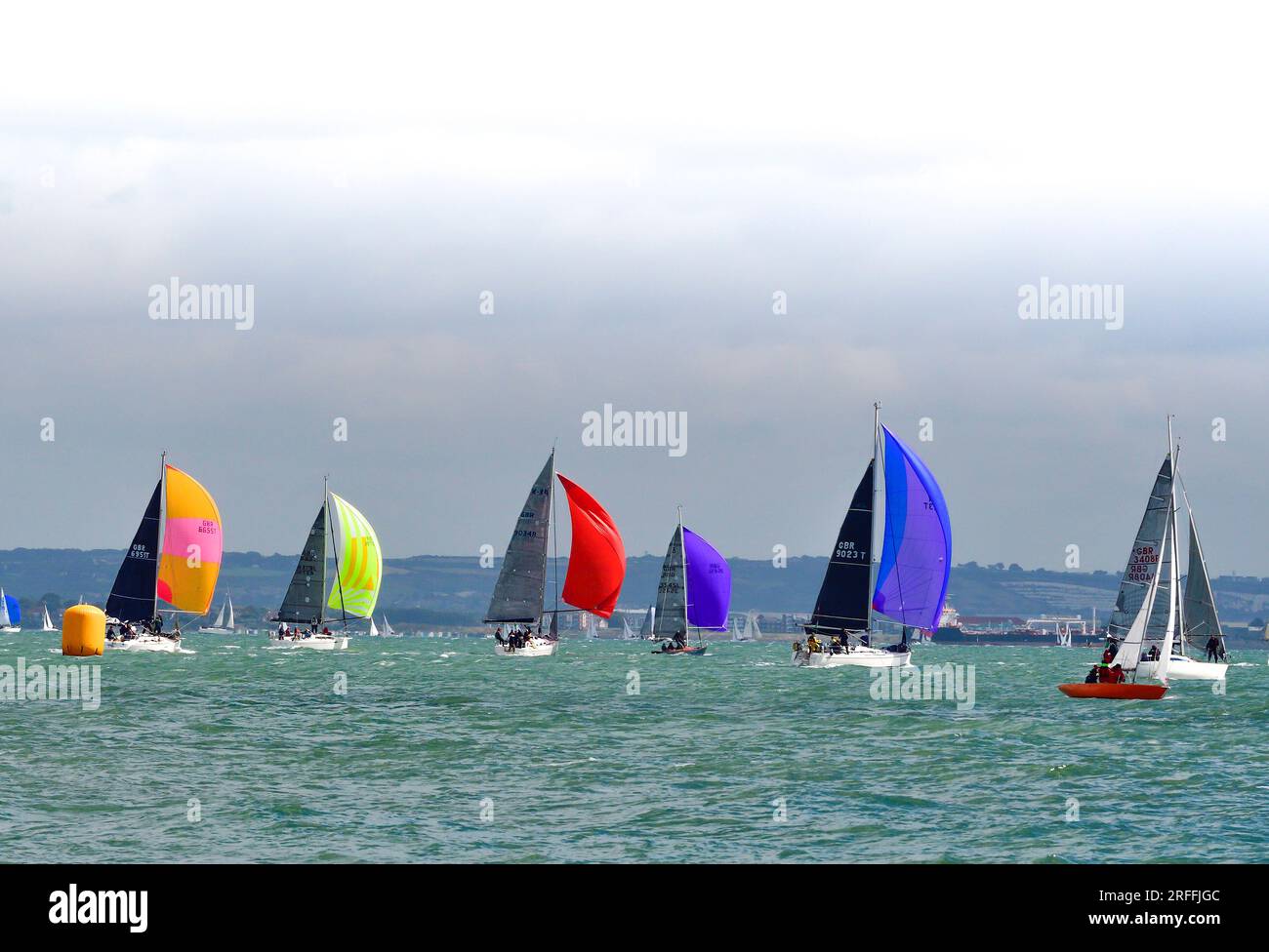 Cowes week 2023 Tuesday 1 August  Performance Cruiser (Division B on a spinnaker start from the Royal Yacht Squadron line during Cowes Week Stock Photo