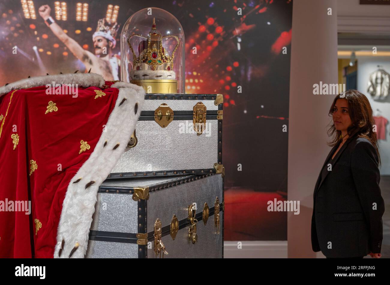 Sotheby's, London, UK. 3 August 2023. An exhibition of the contents of Freddie Mercury's London home filling Sotheby's London Galleries, on view 4 Aug-5 Sept ahead of six dedicated auctions at Sotheby's, London, in September. Image: Freddie Mercury's crown and accompanying cloak, in fake fur, red velvet and rhinestones, made by his friend and costume designer Diana Moseley, thought to be loosely modelled on the coronation crown of the United Kingdom. Indelibly linked to Mercury, they were worn for the finale rendition of “God Save The Queen” during his last tour with Queen, ‘The Magic Tour', w Stock Photo