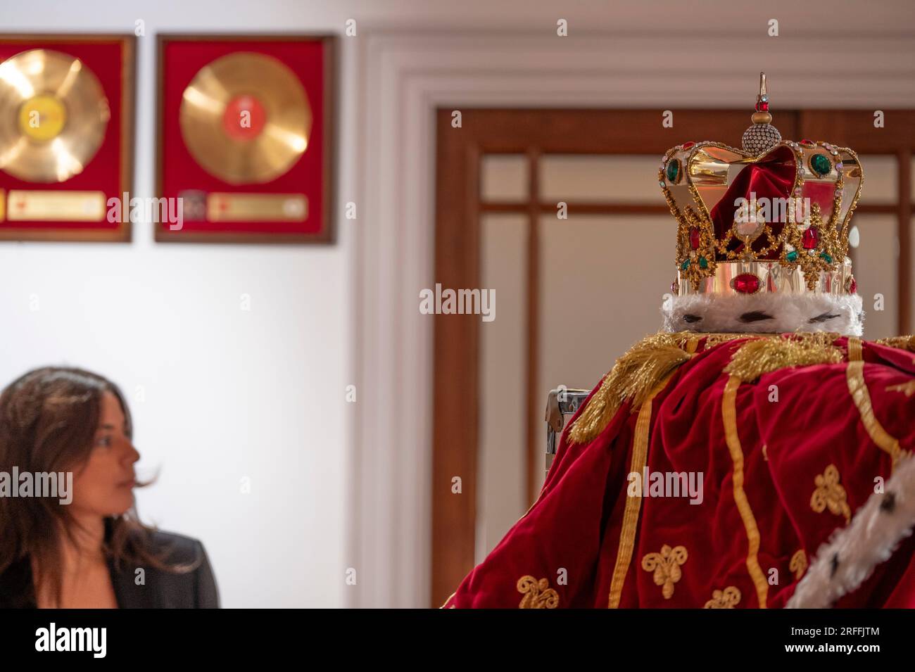 Sotheby's, London, UK. 3 August 2023. An exhibition of the contents of Freddie Mercury's London home filling Sotheby's London Galleries, on view 4 Aug-5 Sept ahead of six dedicated auctions at Sotheby's, London, in September. Image: Freddie Mercury's crown and accompanying cloak, in fake fur, red velvet and rhinestones, made by his friend and costume designer Diana Moseley, thought to be loosely modelled on the coronation crown of the United Kingdom. Indelibly linked to Mercury, they were worn for the finale rendition of “God Save The Queen” during his last tour with Queen, ‘The Magic Tour', w Stock Photo