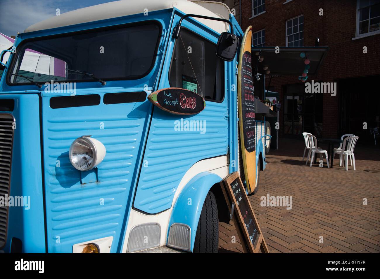Bright blue Citroen Type H serves as a vintage style food truck Stock Photo