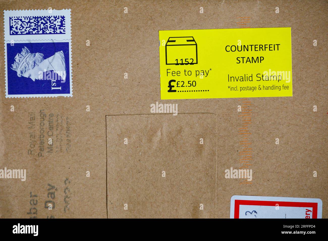 Royal Mail counterfeit 1st class Queen Elizabeth stamp on brown paper envelope. There is a yellow counterfeit Stamp, invalid stamp label attached. Stock Photo