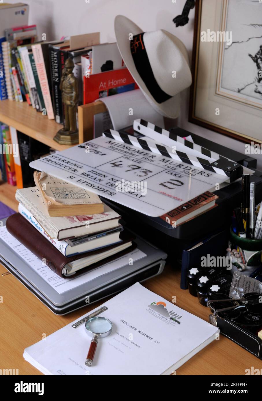 An old clapperboard and script from the long running British crime drama television series Midsomer Murders. Stock Photo
