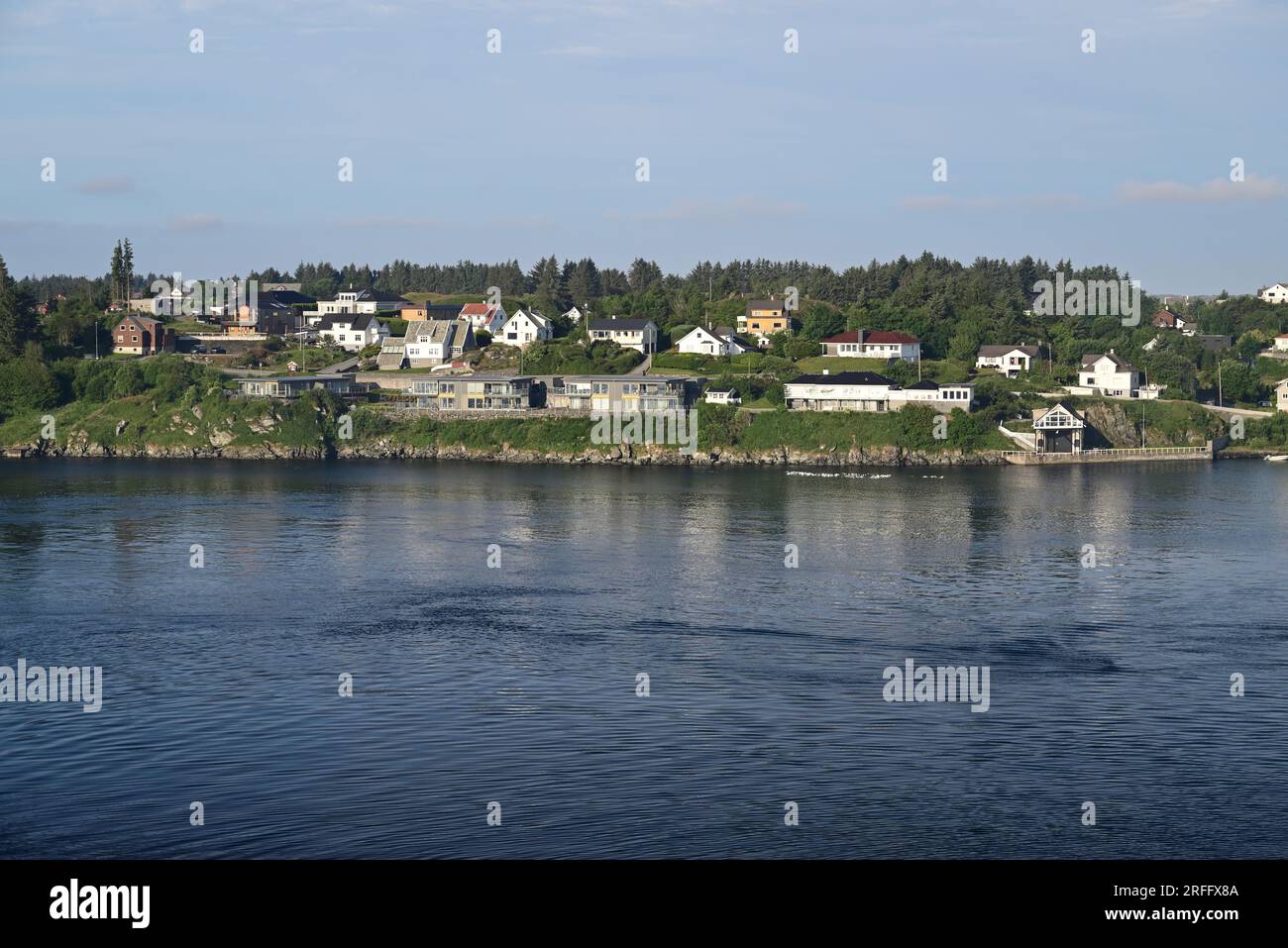 Houses along the waterfront on Karmoy island opposite Haugesund, Norway. Stock Photo