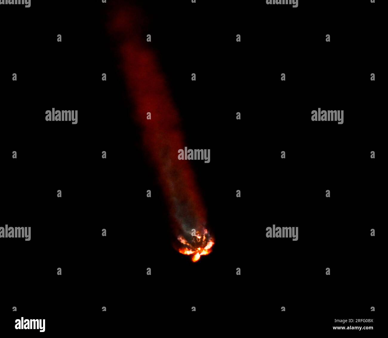 The exhaust plume of the SpaceX Falcon 9 rocket turns red at altitude