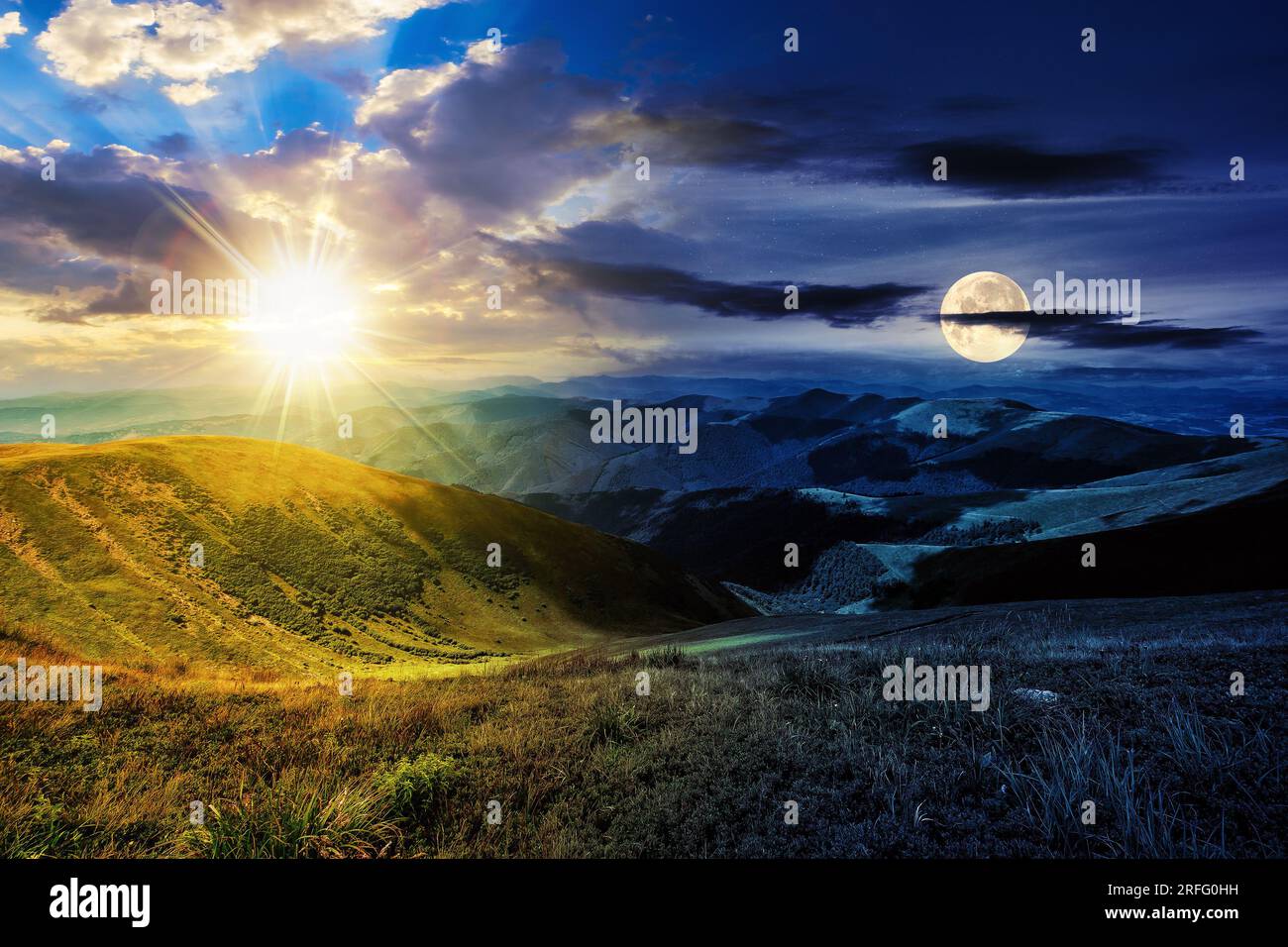 green grass on hillside meadow in high mountains under the cloudy blue sky with sun and moon at twilight. day and night time change concept. mysteriou Stock Photo
