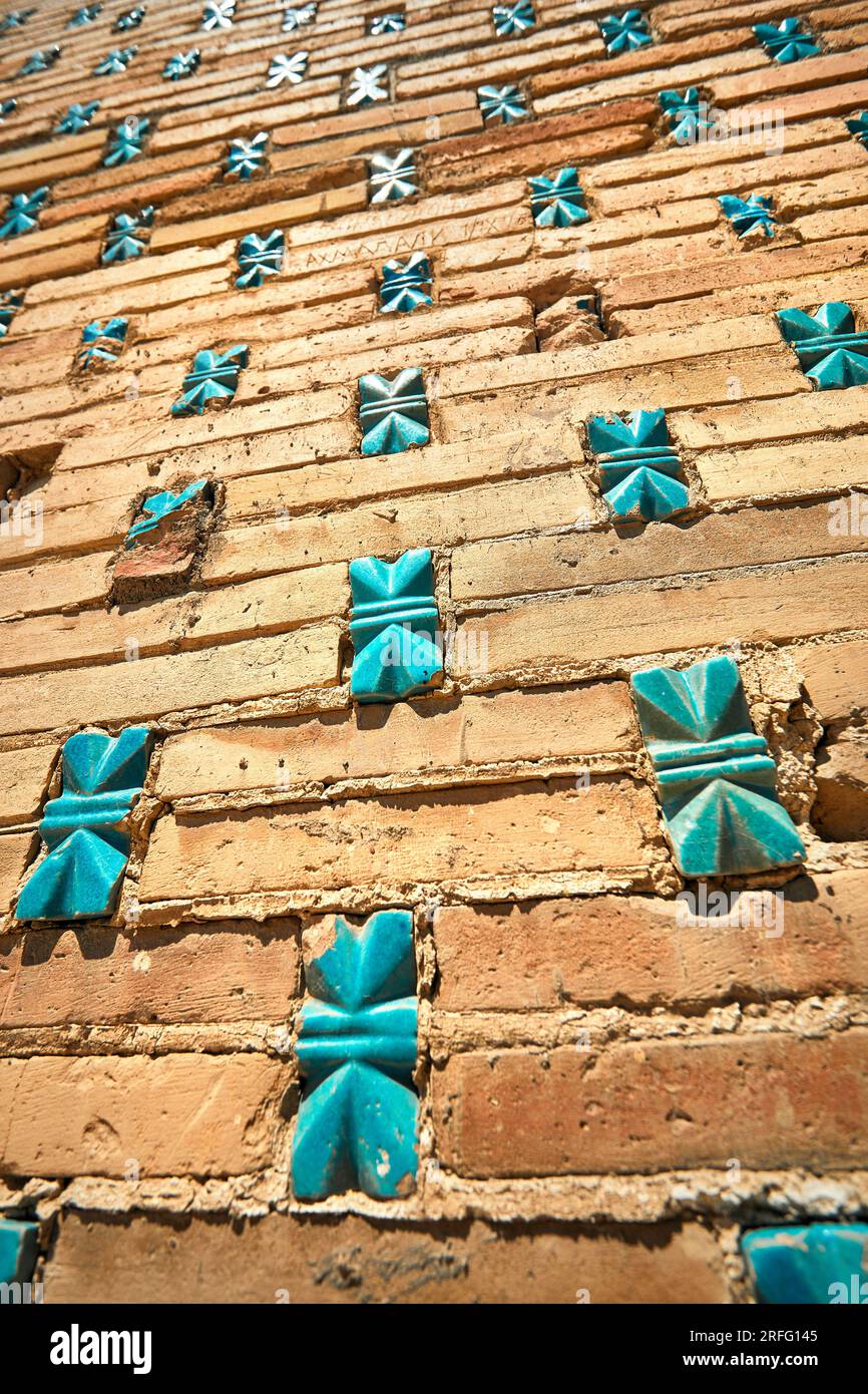 Wall with turquoise stone mosaic of beautiful Historical cemetery of Shahi Zinda mausoleums in Samarkand, Uzbekistan. Stock Photo