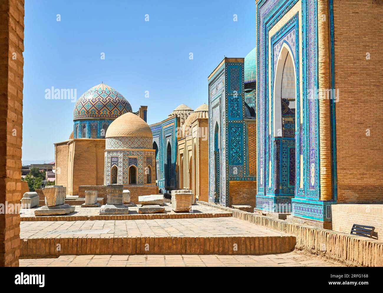 Beautiful Historical cemetery of Shahi Zinda entry Gate with finely decorated by blue and turquoise stone mosaic mausoleums in Samarkand, Uzbekistan. Stock Photo