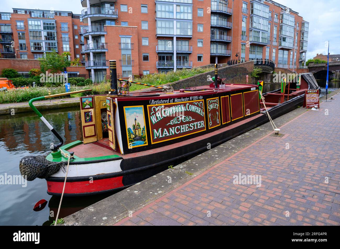Historic working narrowboat Swift moored before taking passengers on a sightseeing trip on a canal in Birmingham Stock Photo