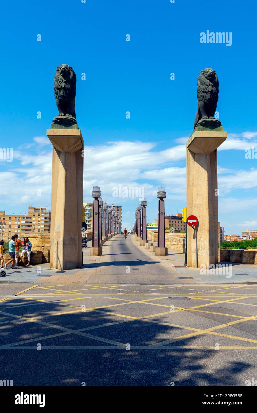 Front view of Lion statues at the Stone Bridge over Ebro river in Zaragoza. Aragon, Spain. Stock Photo