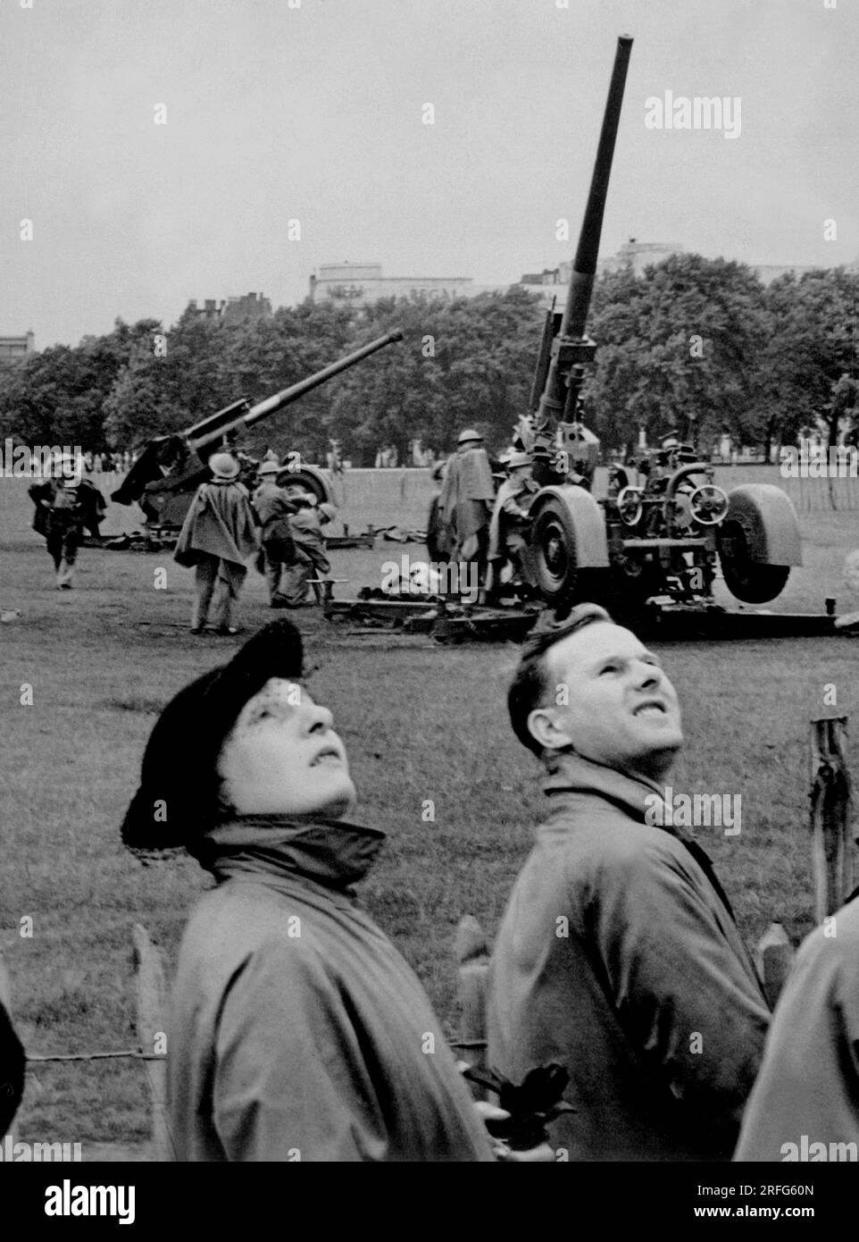 LONDON, ENGLAND, UK - August 1939 - Anti-aircraft guns in Hyde Park go into action as 'enemy bombers' make a daylight raid on London, during giant air Stock Photo