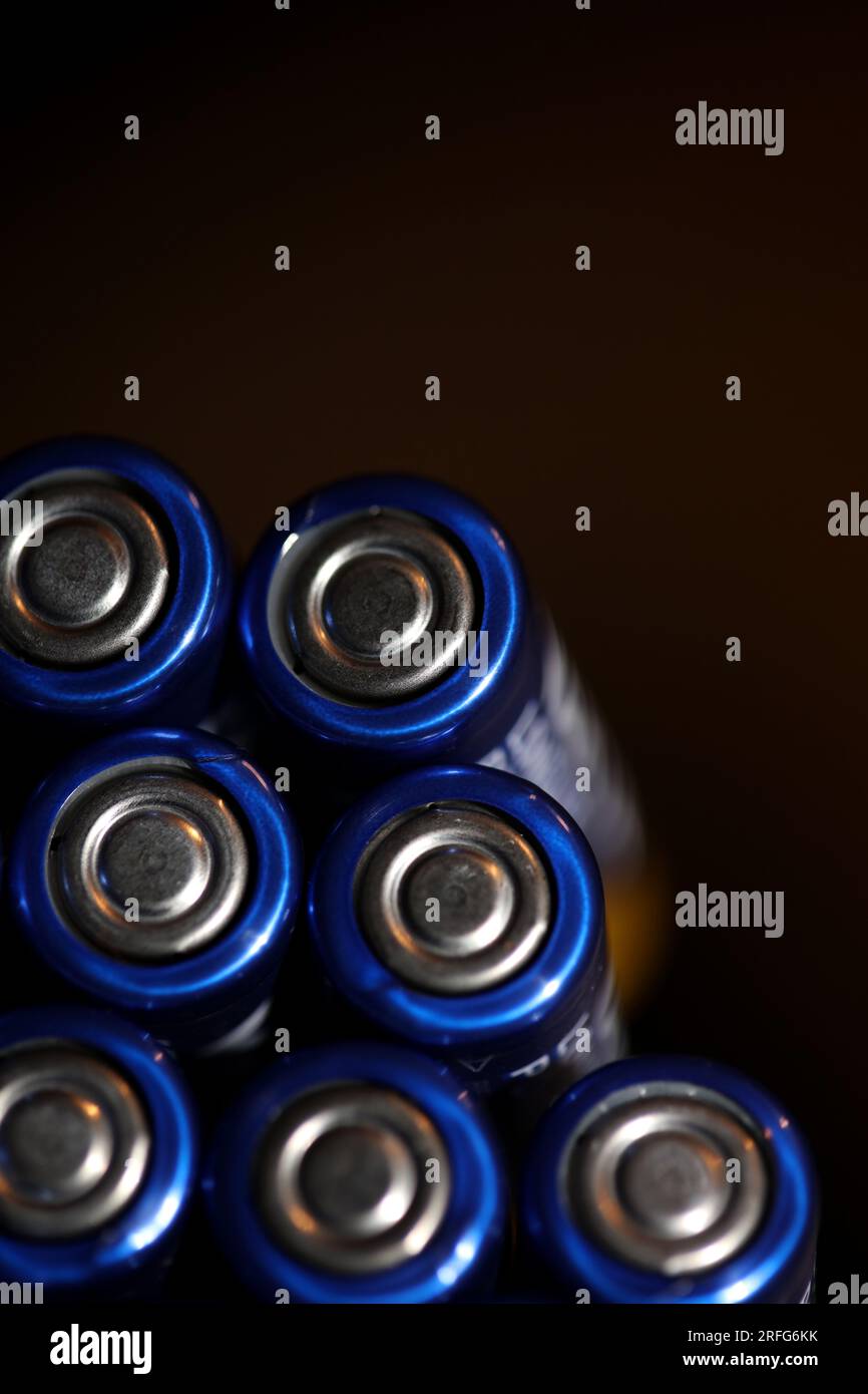 Close up background of various alkaline rechargeable batteries AA for modules mass production accumulators high power and energy for electric vehicles Stock Photo