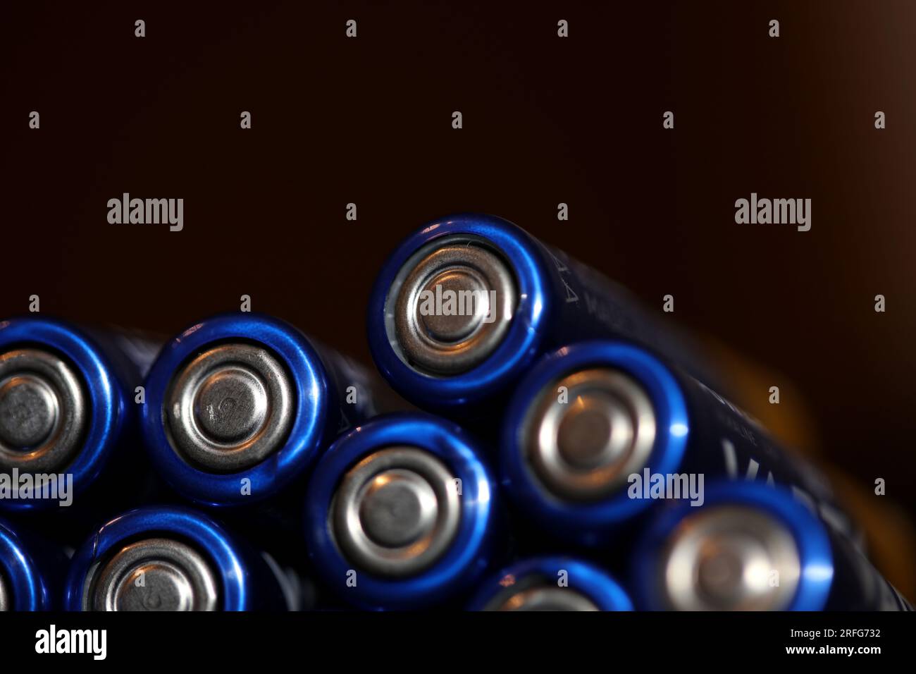 Close up background of various alkaline rechargeable batteries AA for modules mass production accumulators high power and energy for electric vehicles Stock Photo