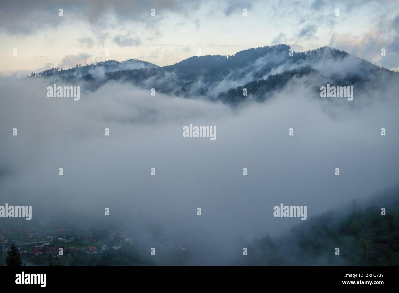 Fog over the mountains. Aerial view of fog over mountains in morning. Stock Photo