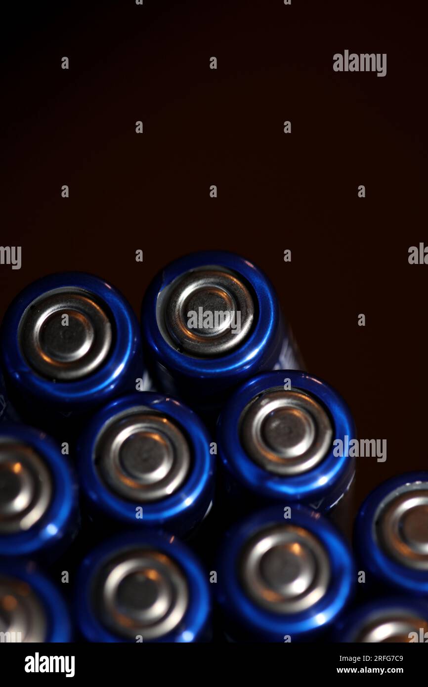 Close up background of various alkaline rechargeable batteries AA for modules mass production accumulators high power and energy for electric vehicles Stock Photo