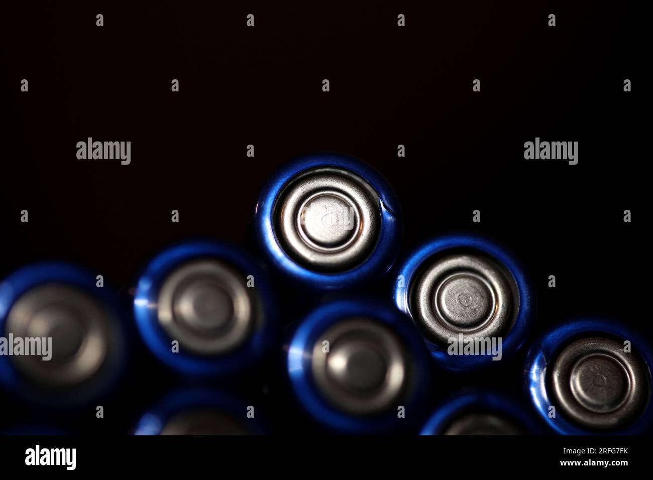 Close up background of various alkaline rechargeable batteries AA for modules mass production accumulators high power and energy for electric vehicles Stock Photo