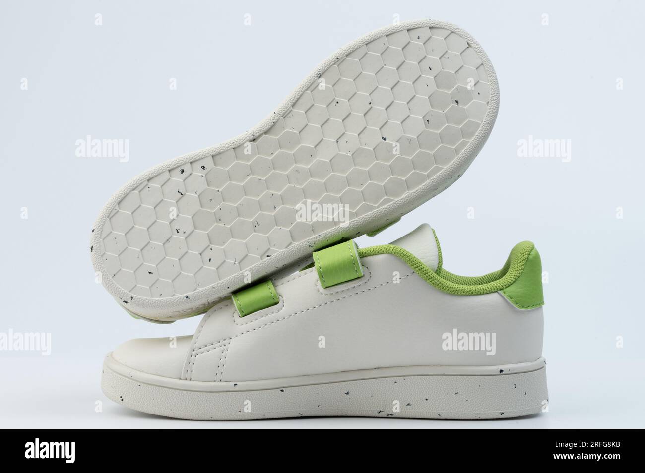 New child pair sneakers shoes side view with green velcro isolated Stock Photo