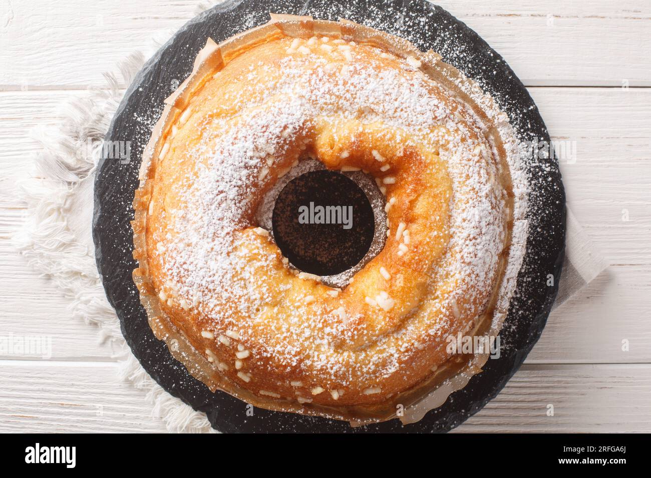 Ciambella cake is a traditional Italian breakfast treat closeup on the table. Horizontal top view from above Stock Photo
