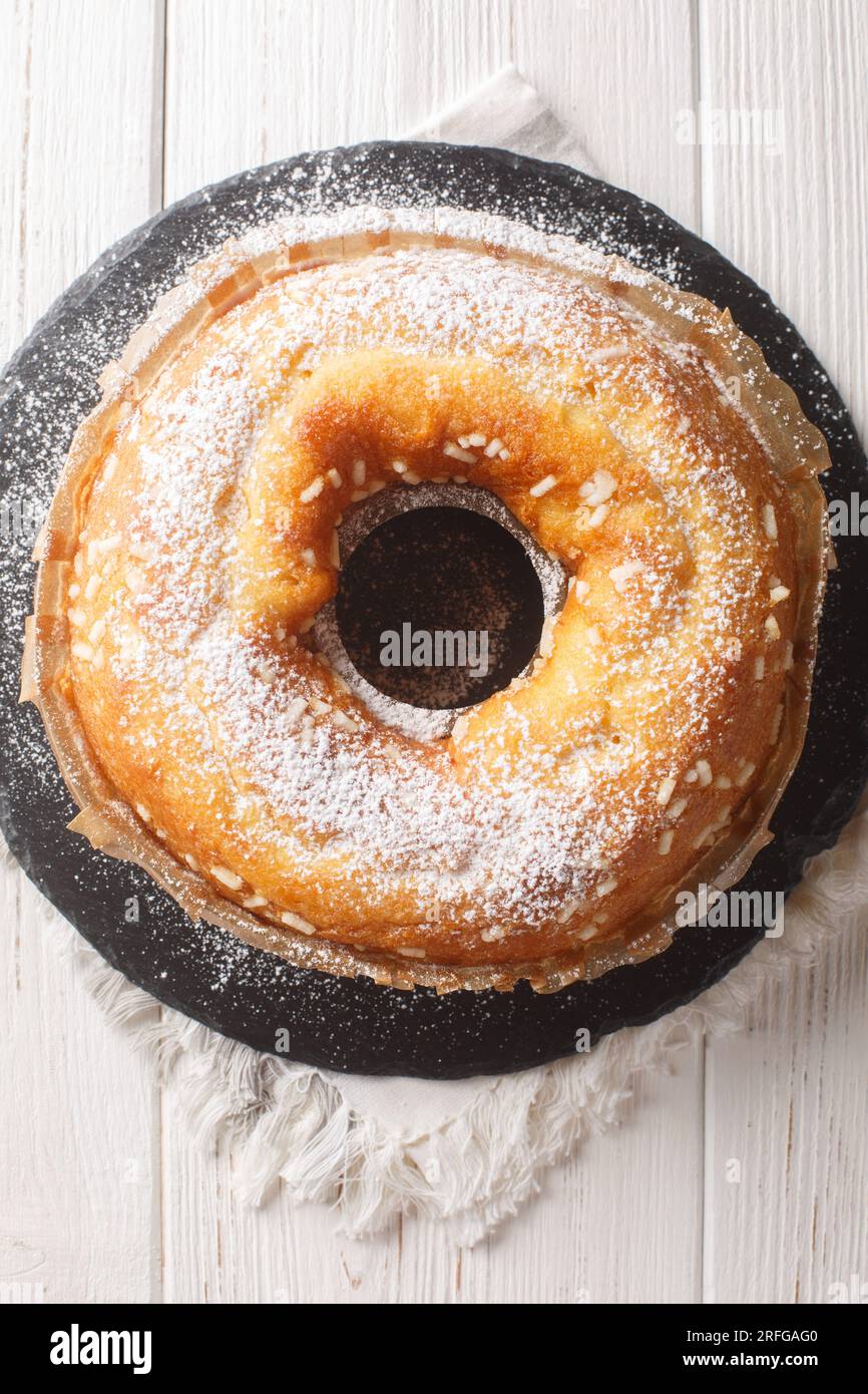 Basic Italian breakfast cake Ciambella closeup on the table. Vertical top view from above Stock Photo