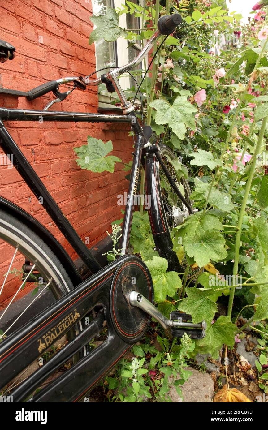 Traditional style Raleigh bicycle in Mollestien, Aarhus, Denmark. Stock Photo