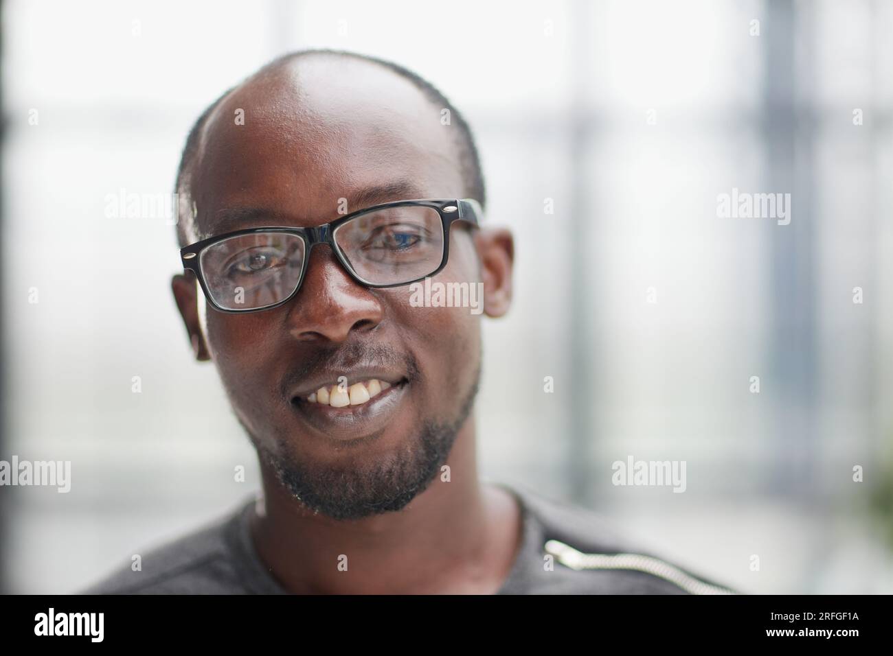 African young man standing hi-res stock photography and images - Alamy