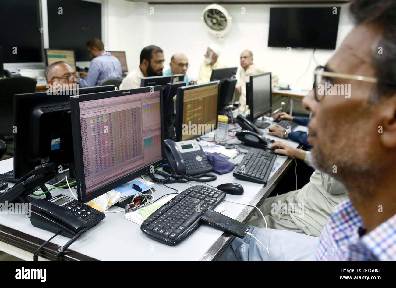 Brokers are busy in trading at Pakistan Stock Exchange (PSX) in Karachi on Thursday, August 3, 2023. Pakistan Stock Exchange witnesses bullish trend in the first session as KSE-100 Index surges by over 570 points and crosses bench mark of 49000. Stock Photo