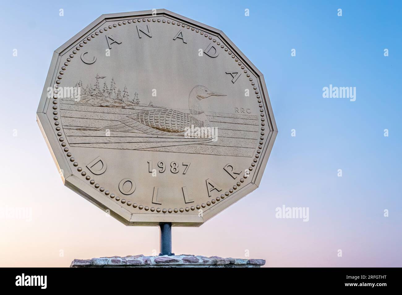 The World's Largest Loonie is a roadside attraction located in Echo Bay Ontario Canada. Stock Photo