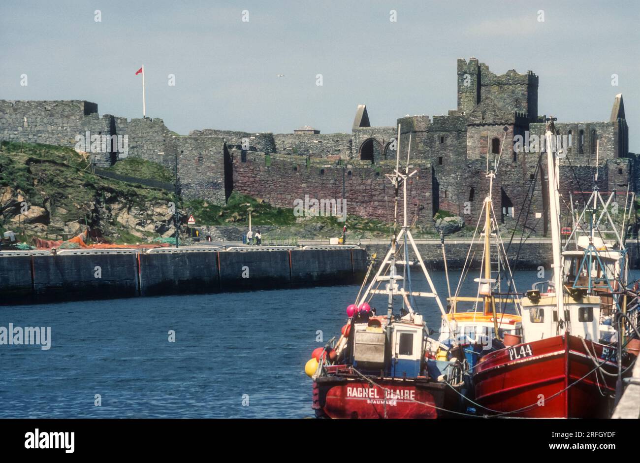 1989 archive photograph of Peel Castle from the harbour, Isle of Man. Stock Photo