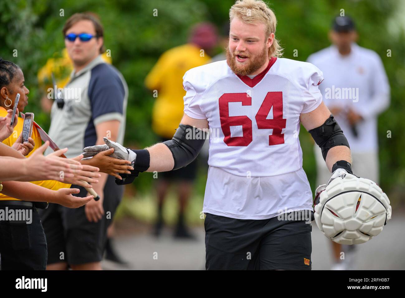 New Orleans Saints offensive lineman Mark Evans II (68), left, and  offensive tackle Nick Saldiveri (64) run through drills at the NFL team's  football training camp in Metairie, La., Wednesday, Aug. 2