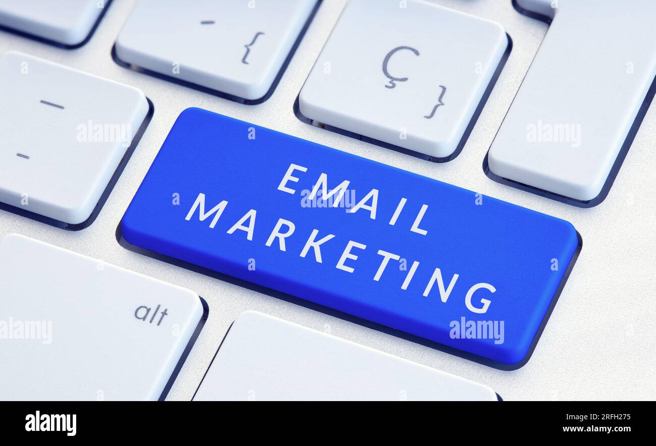 Email Marketing concept. Phrase on blue computer Keyboard Key Stock Photo