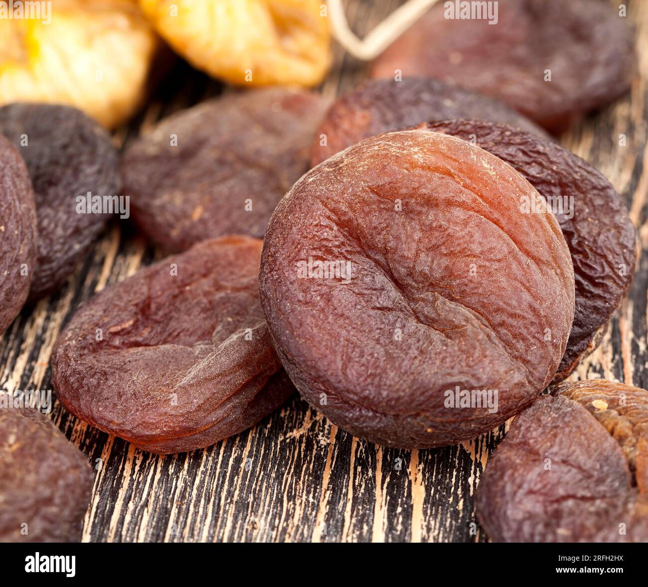 dark dried apricots of large size, dried apricots in sunlight with