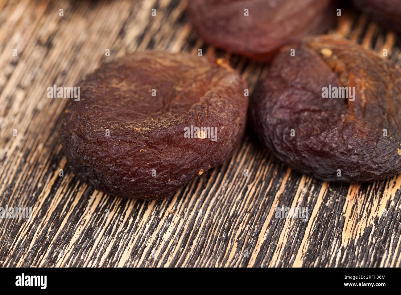dark dried apricots of large size, dried apricots in sunlight with