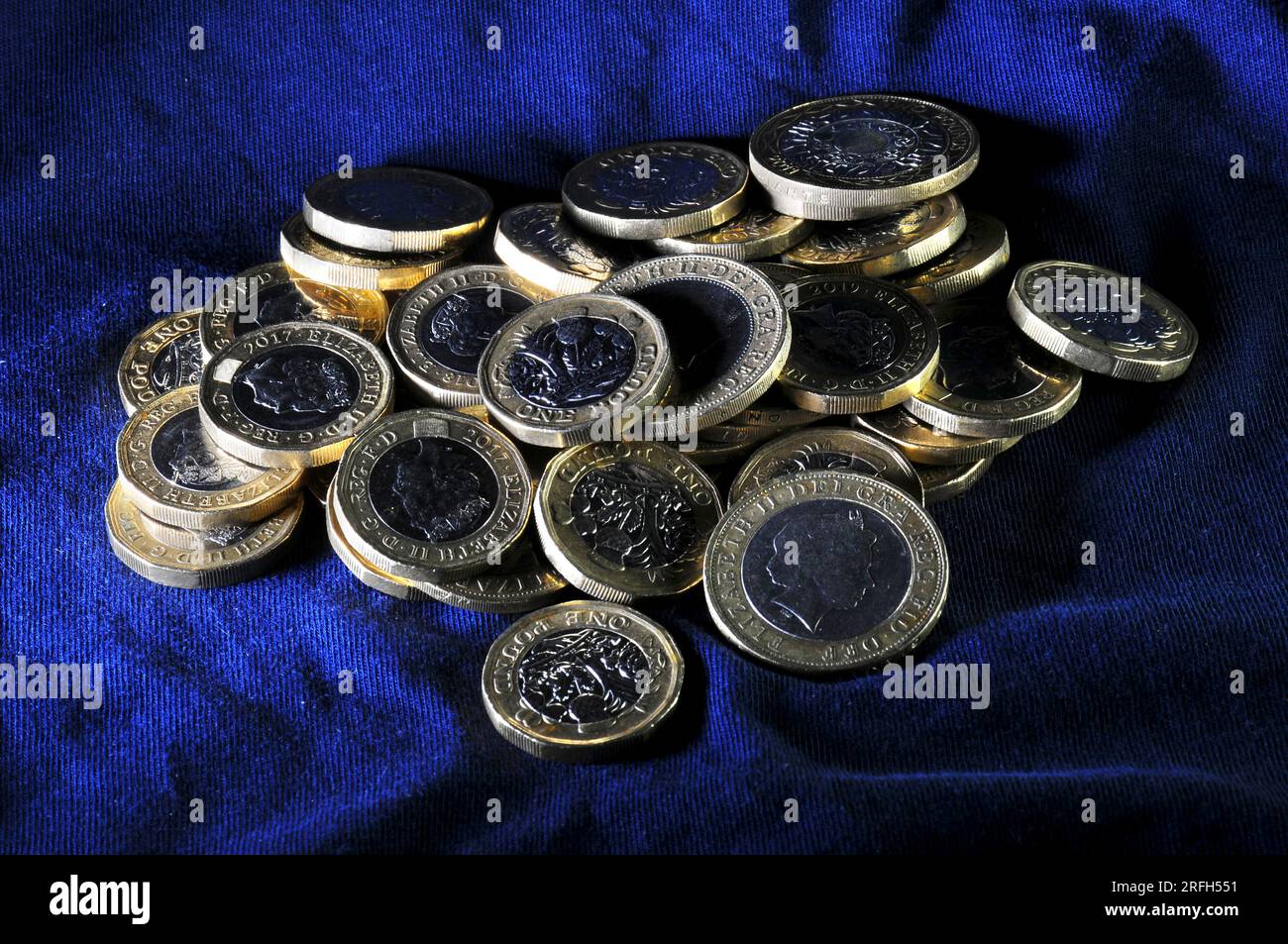 Loose pile of one pound and two pound coins Stock Photo