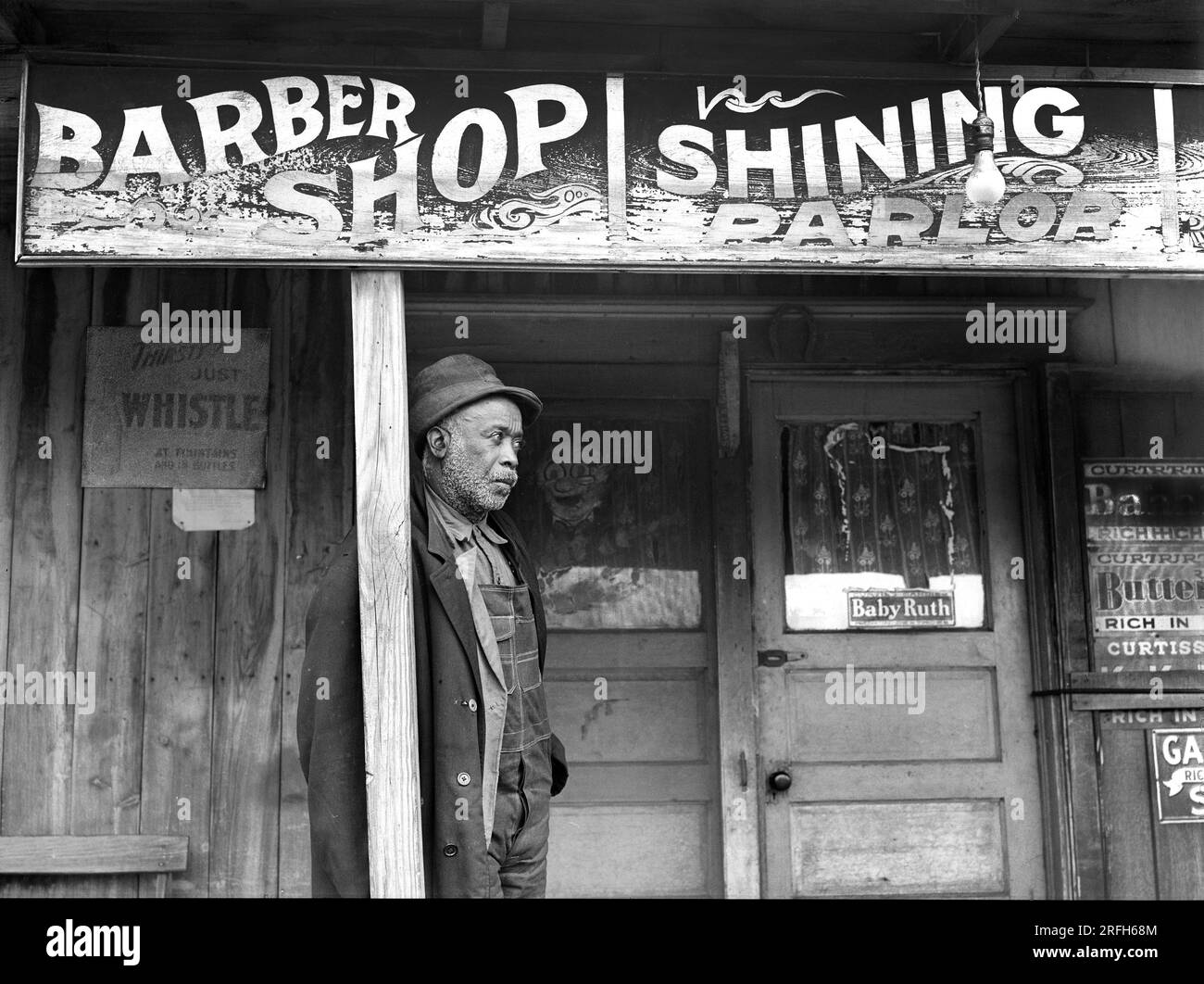 Coal miner standing outside barber shop, Colp, Illinois, USA, Arthur Rothstein, U.S. Farm Security Administration, January 1939 Stock Photo