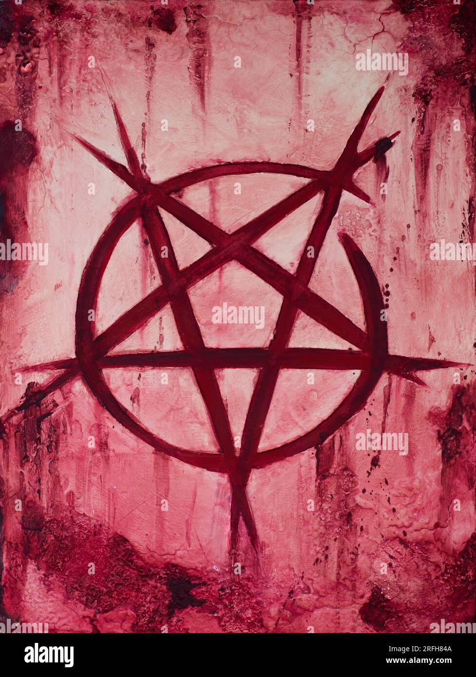 Painting about an inverted pentagram cut on bleeding skin Stock Photo