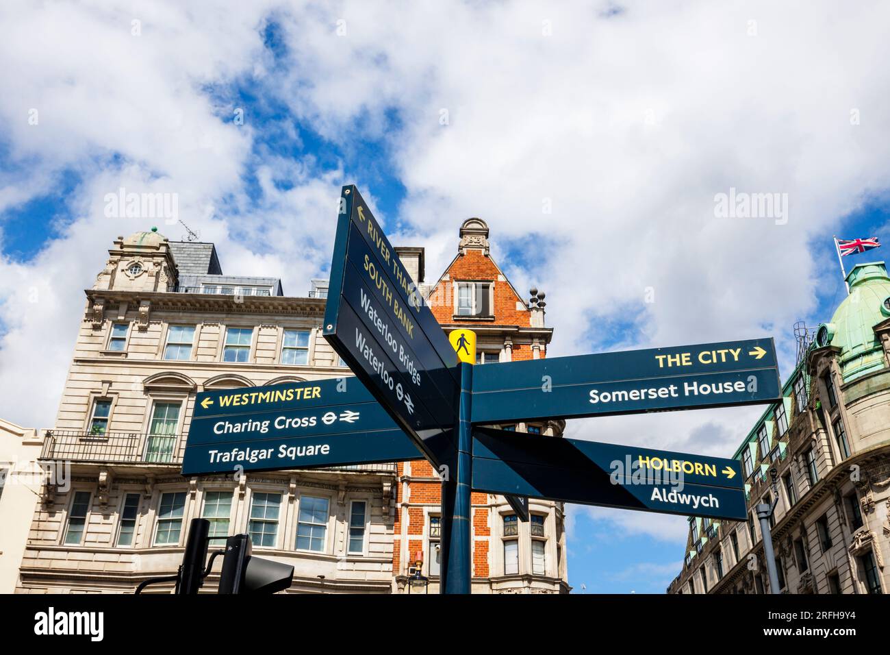 Roadside direction signpost in The Strand pointing to areas, amenities and attractions in London, City, Westminster, Holborn Stock Photo