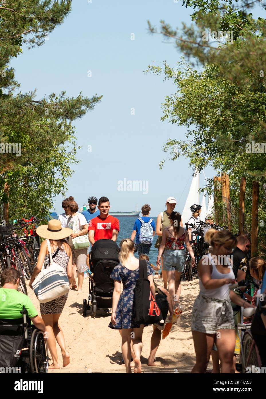 Gdansk beach Beachgoers at an entrance to Brzezno Beach, Gdansk, Baltic Sea, Poland Stock Photo