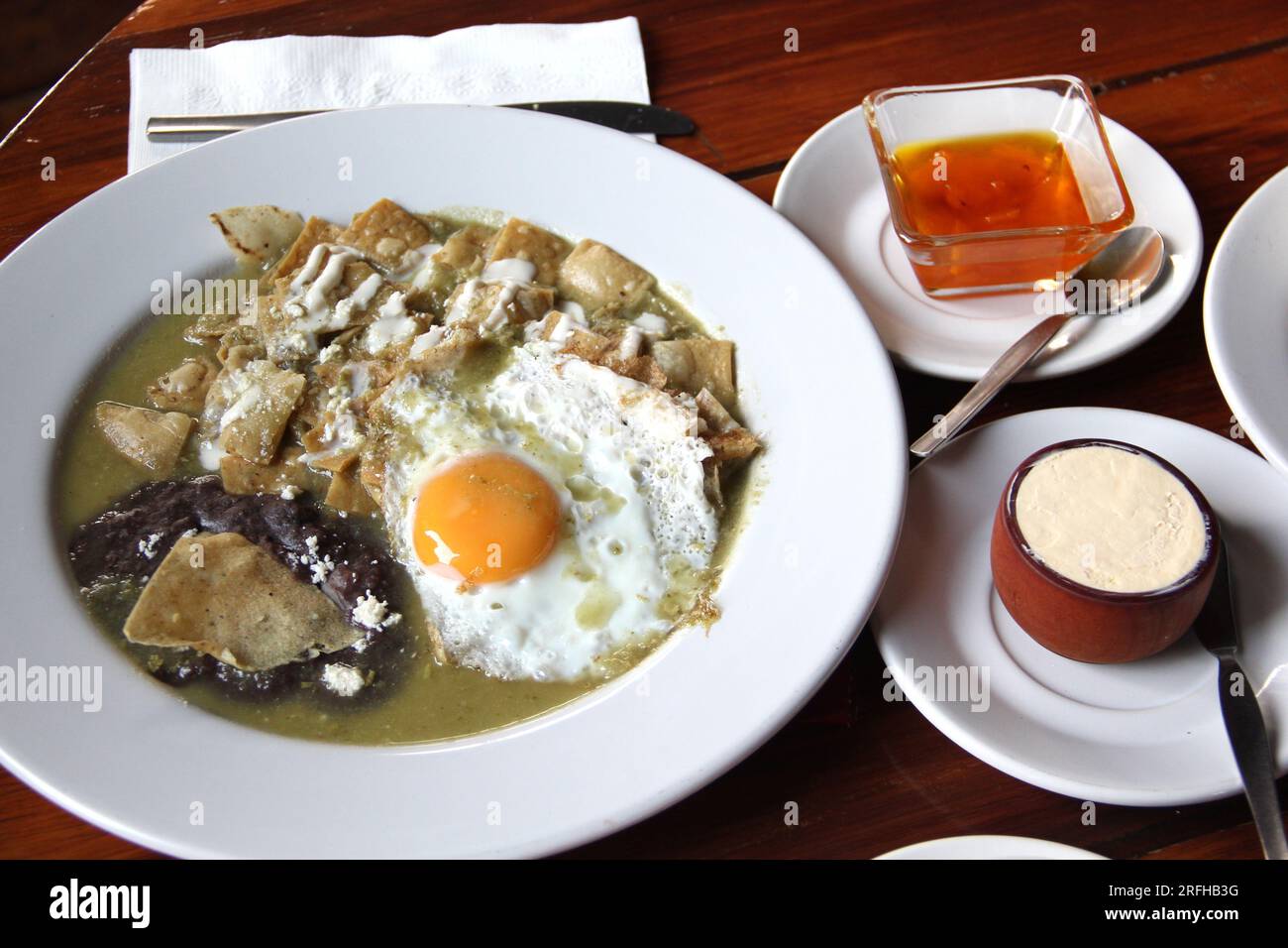Delicious Mexican breakfast with coffee, sweet bread, beans