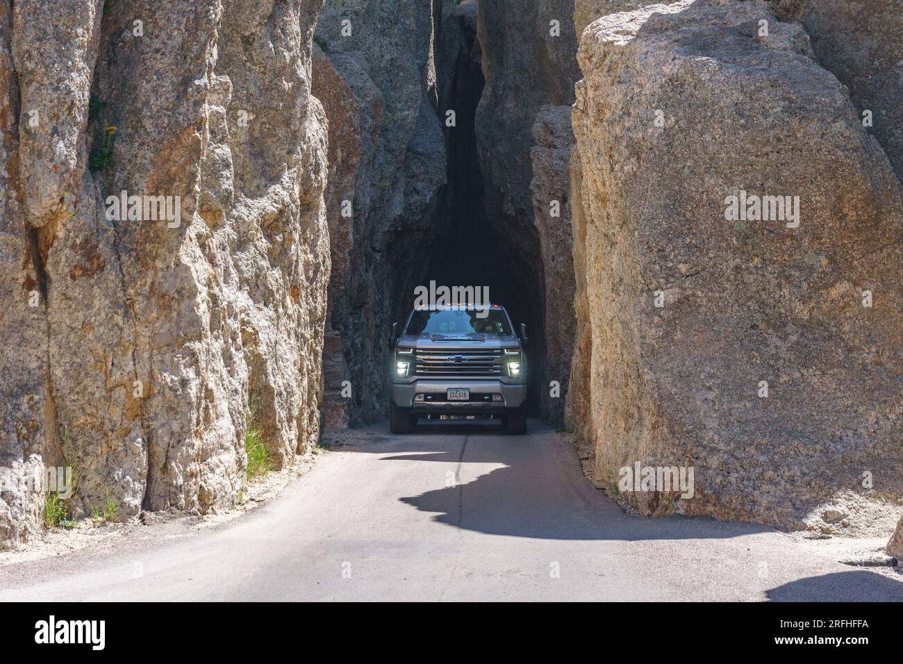Truck going through Needles Eye tunnel in Needles Highway, Black Hills