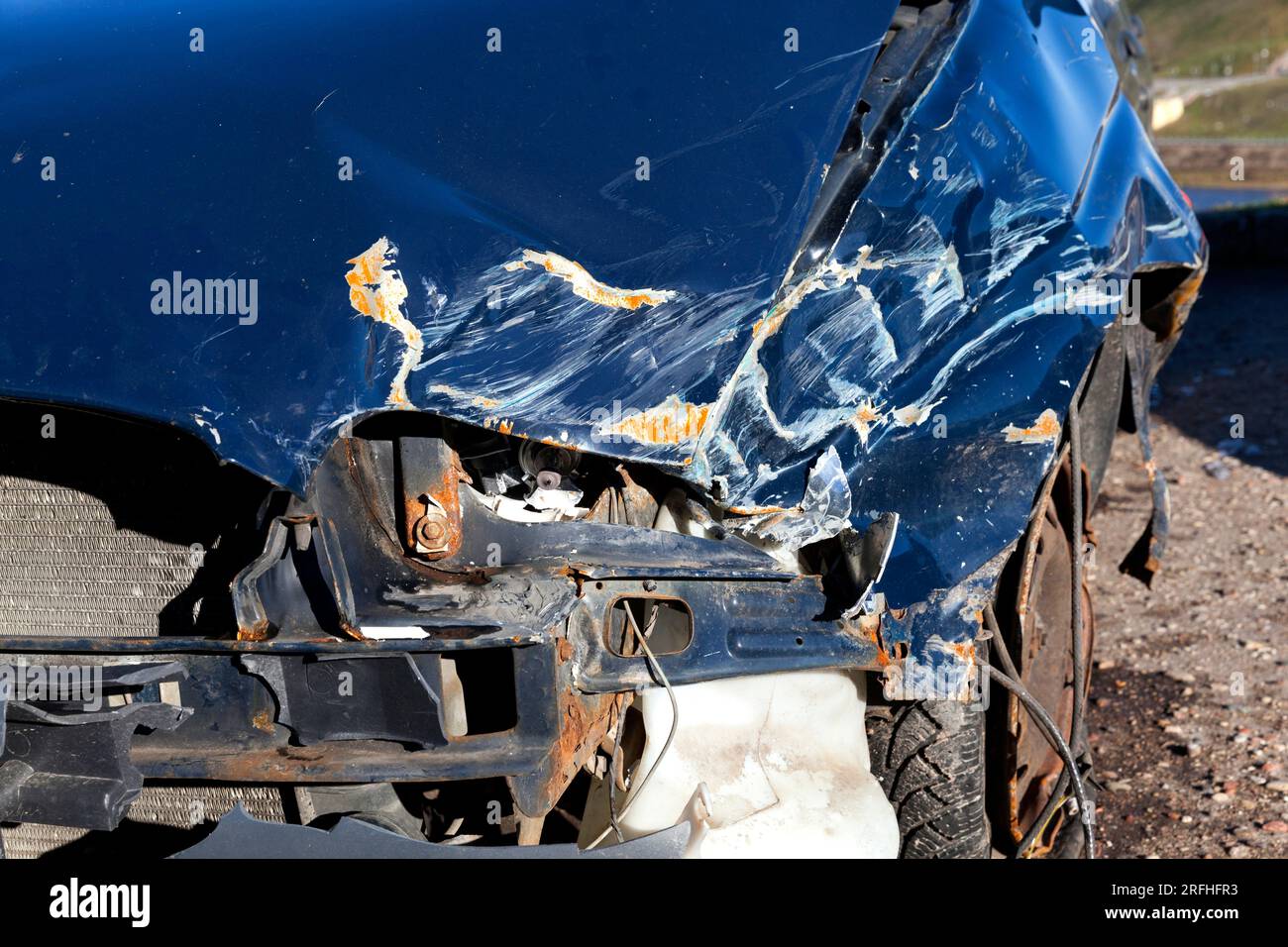 part of the blue car after the accident on the road, the destruction of the car after the accident Stock Photo