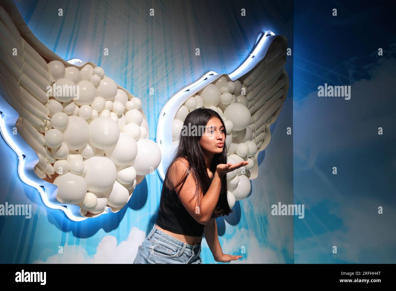 Tel Aviv, Israel. 3rd Aug, 2023. A visitor poses for photos at the