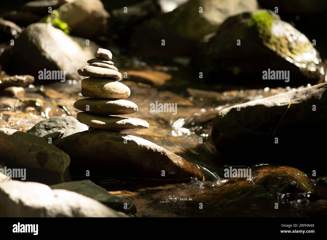 Meditation stones in stream Stock Photo