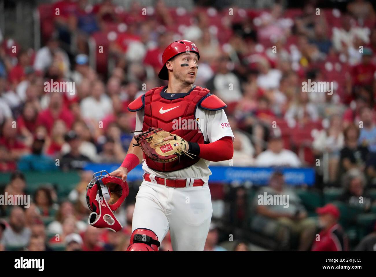St. Louis Cardinals catcher Andrew Knizner chases down a foul ball during  the third inning of a baseball game against the Minnesota Twins Thursday,  Aug. 3, 2023, in St. Louis. (AP Photo/Jeff