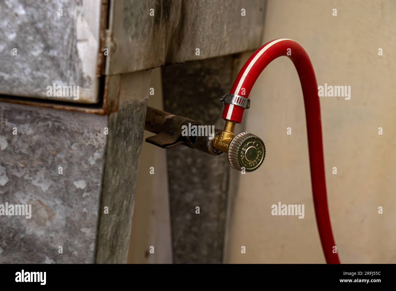 Arabic oven shut off/on valve with red gas pipe Stock Photo